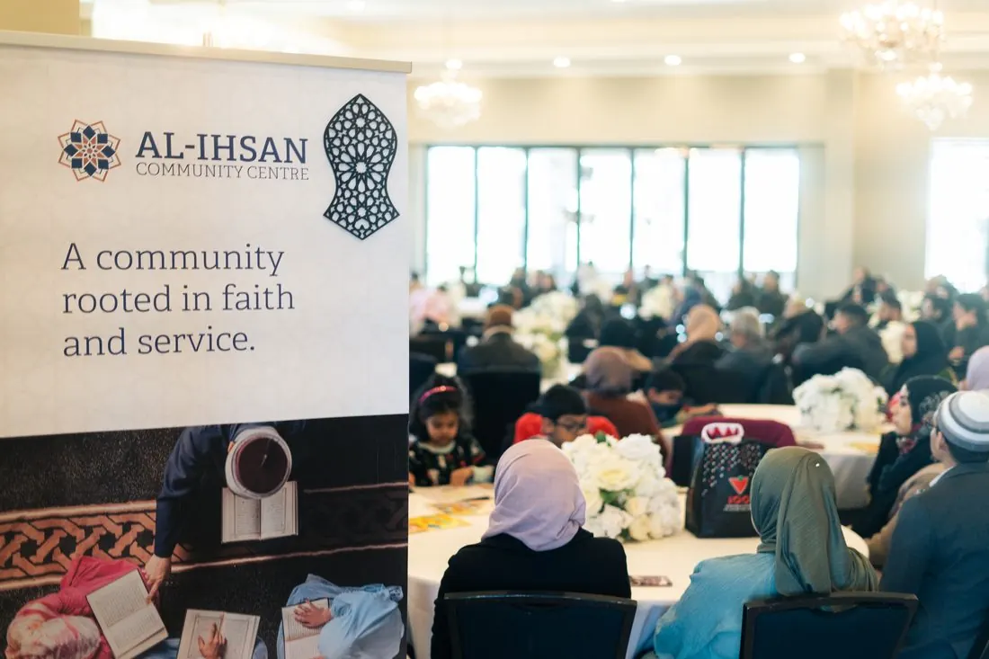 Families seated at a community fundraiser dinner